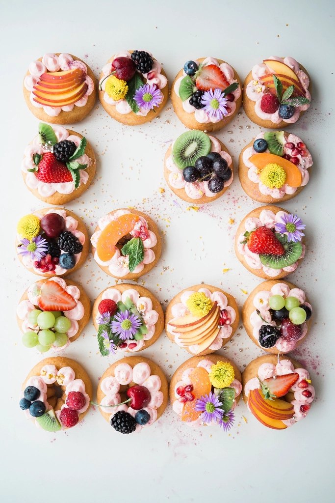 Assorted donuts top white area